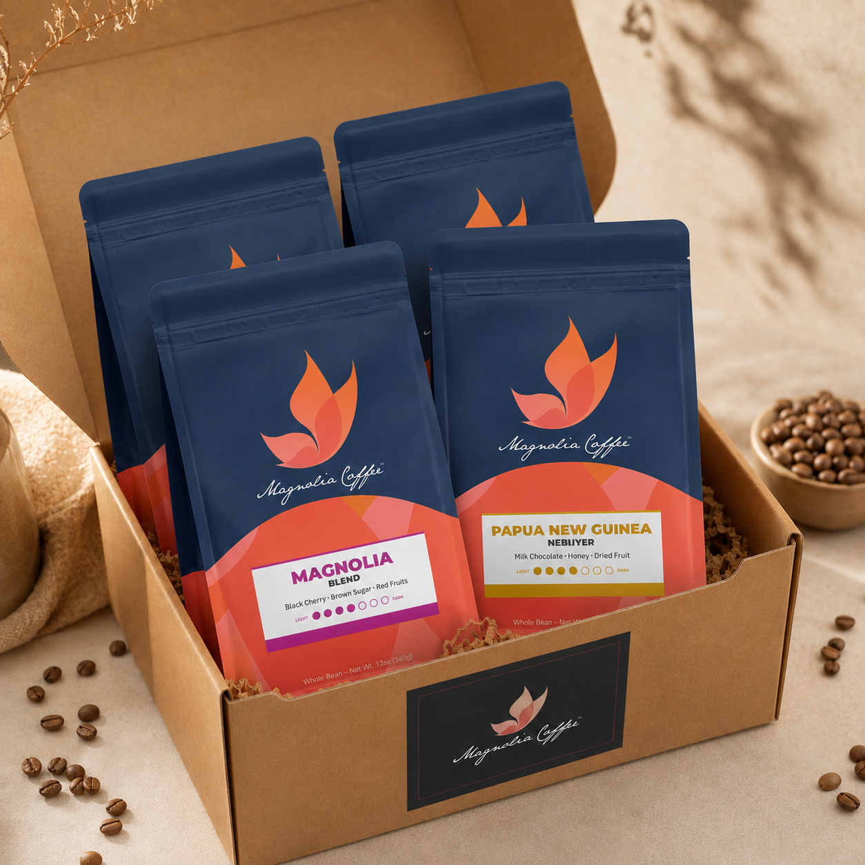 Box of Magnolia Coffee packages with coffee beans around